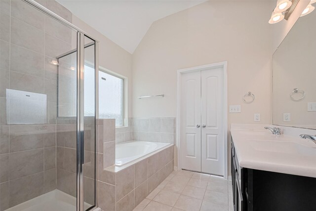 19911 Whistle Creek Ln, Cypress, TX 77433 - full bathroom with a stall shower, tile patterned flooring, lofted ceiling, and a garden tub