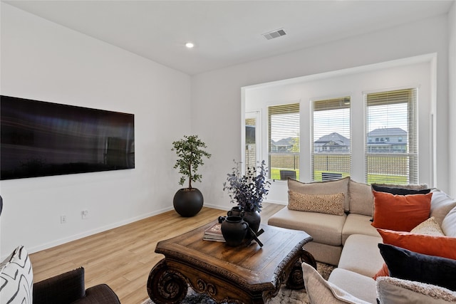 31811 Snapdragon Glen Trl, Hockley, TX 77447 - living room featuring baseboards, recessed lighting, visible vents, and wood finished floors