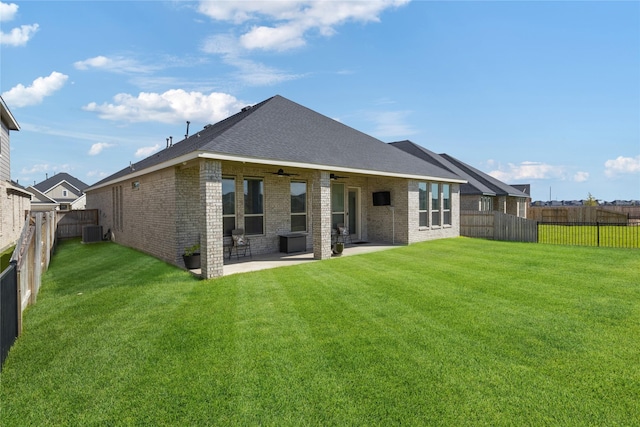 31811 Snapdragon Glen Trl, Hockley, TX 77447 - back of house with a ceiling fan, central AC unit, brick siding, and a fenced backyard