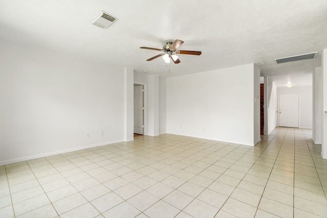5315 Cilantro Ln, Baytown, TX 77521 - spare room featuring ceiling fan, light tile patterned floors, and baseboards