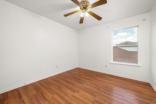 5315 Cilantro Ln, Baytown, TX 77521 - unfurnished room with wood finished floors, baseboards, and ceiling fan