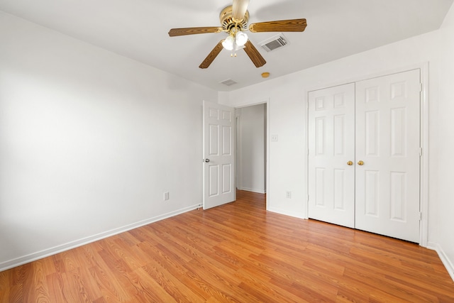 5315 Cilantro Ln, Baytown, TX 77521 - unfurnished bedroom with light wood-style flooring, baseboards, a closet, and a ceiling fan