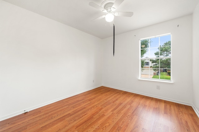 5315 Cilantro Ln, Baytown, TX 77521 - spare room with light wood-style floors, baseboards, and ceiling fan