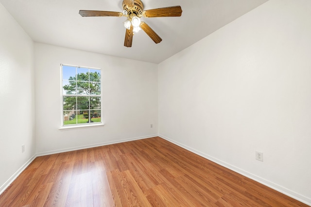 5315 Cilantro Ln, Baytown, TX 77521 - spare room with light wood finished floors, baseboards, and ceiling fan