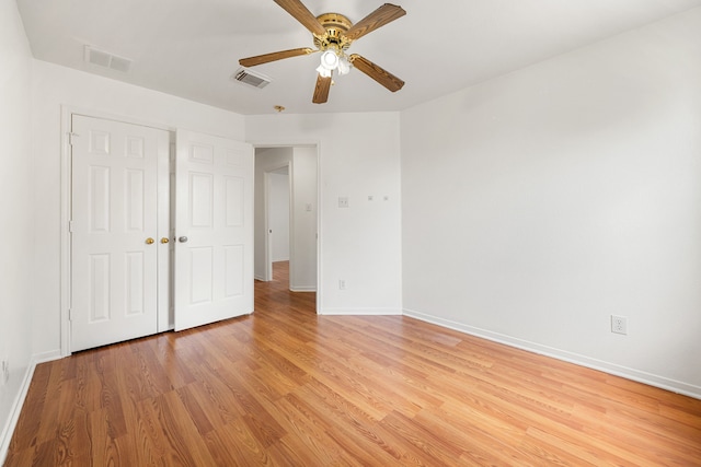 5315 Cilantro Ln, Baytown, TX 77521 - unfurnished bedroom featuring light wood-type flooring, baseboards, and a ceiling fan