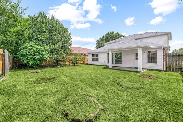 5315 Cilantro Ln, Baytown, TX 77521 - rear view of property with a patio area and a shingled roof