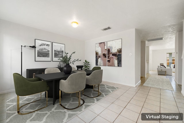 5315 Cilantro Ln, Baytown, TX 77521 - dining area featuring light tile patterned flooring and baseboards