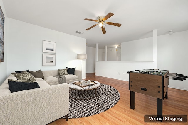 5315 Cilantro Ln, Baytown, TX 77521 - living area featuring a ceiling fan, wood finished floors, and baseboards