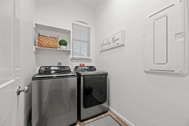 7015 Winterberry Glen Ln, Katy, TX 77493 - washroom with washing machine and clothes dryer, laundry area, and baseboards