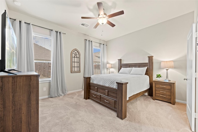 7015 Winterberry Glen Ln, Katy, TX 77493 - bedroom with light colored carpet, visible vents, baseboards, and a ceiling fan
