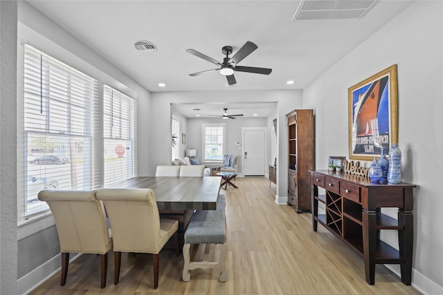 1802 Ursuline St, Galveston, TX 77550 - dining area featuring a healthy amount of sunlight, light wood-type flooring, a ceiling fan, and visible vents
