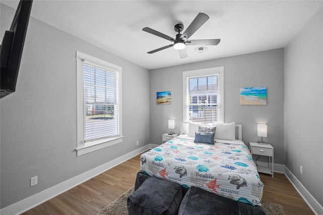 1802 Ursuline St, Galveston, TX 77550 - bedroom featuring wood finished floors, baseboards, and ceiling fan
