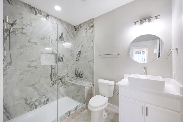 1802 Ursuline St, Galveston, TX 77550 - bathroom with a marble finish shower, baseboards, vanity, and toilet