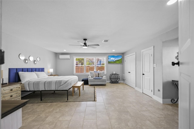 1802 Ursuline St, Galveston, TX 77550 - bedroom with light tile patterned floors, multiple closets, visible vents, ceiling fan, and a wall mounted AC