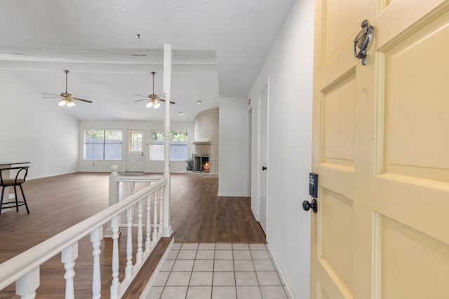 hallway with baseboards and light wood-style flooring