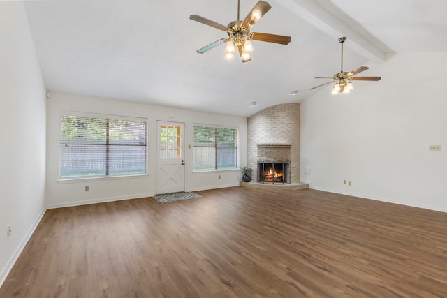 unfurnished living room with wood finished floors, a fireplace, ceiling fan, and baseboards