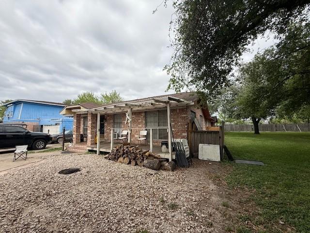 4334 Spring Valley Rd, Houston, TX 77041 - view of front of house featuring brick siding, a pergola, and a patio area