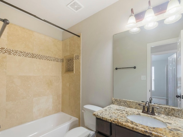 full bathroom with toilet, visible vents, vanity, and tub / shower combination
