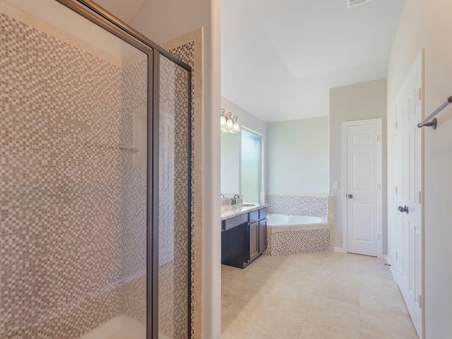 bathroom with visible vents, a bath, a shower stall, tile patterned flooring, and vanity