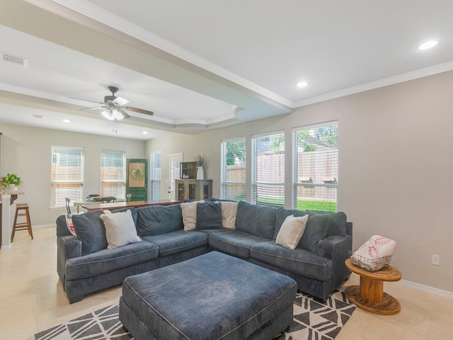 living room with light tile patterned floors, a ceiling fan, crown molding, visible vents, and baseboards