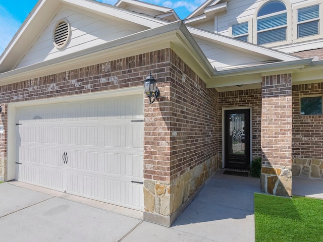 18303 Hillingdon Ln, Tomball, TX 77377 - doorway to property with brick siding, driveway, and an attached garage