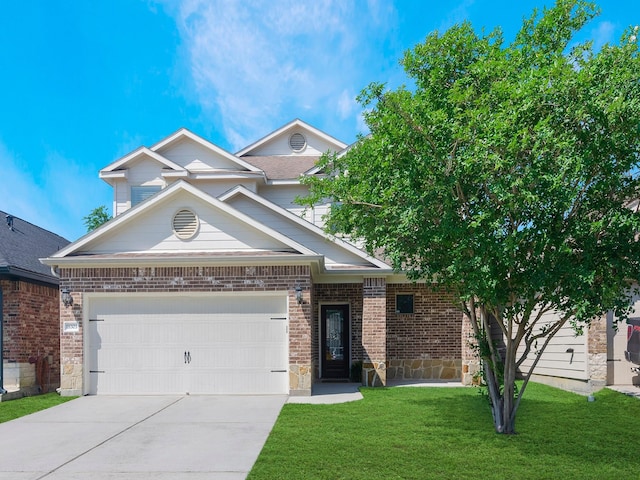 view of front of home featuring driveway, brick siding, a garage, stone siding, and a front lawn