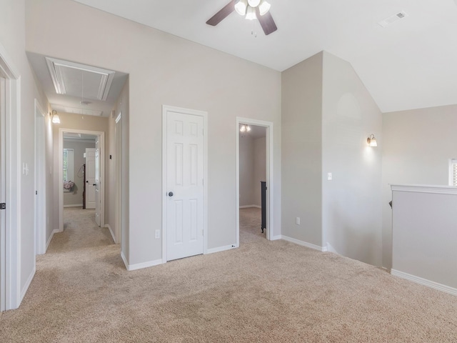 18303 Hillingdon Ln, Tomball, TX 77377 - unfurnished bedroom featuring lofted ceiling, light carpet, visible vents, and attic access