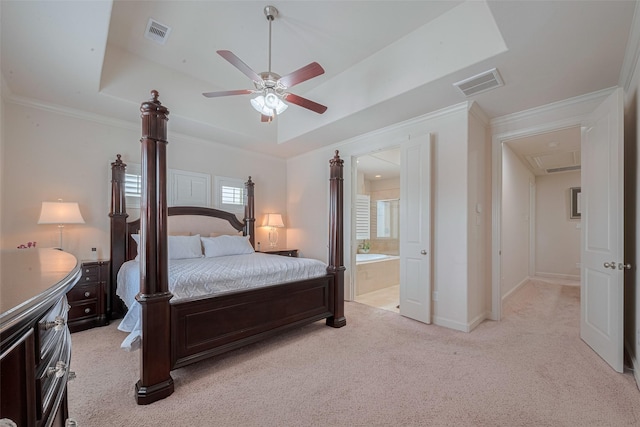 2303 Hadley St, Houston, TX 77003 - bedroom with a tray ceiling, light colored carpet, connected bathroom, ceiling fan, and baseboards
