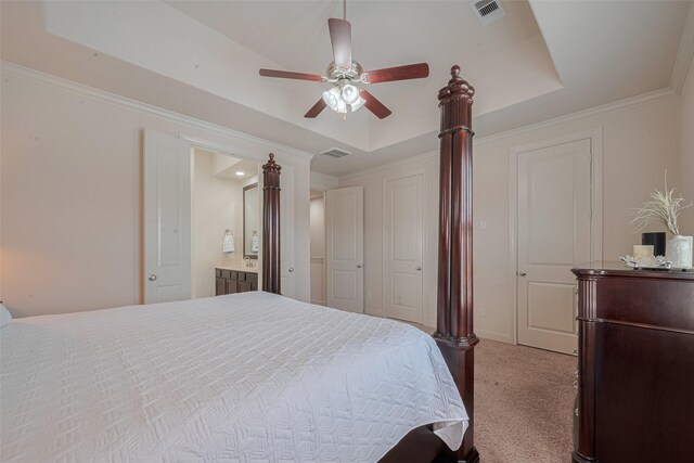 2303 Hadley St, Houston, TX 77003 - carpeted bedroom with a raised ceiling, ornamental molding, ensuite bath, a ceiling fan, and baseboards