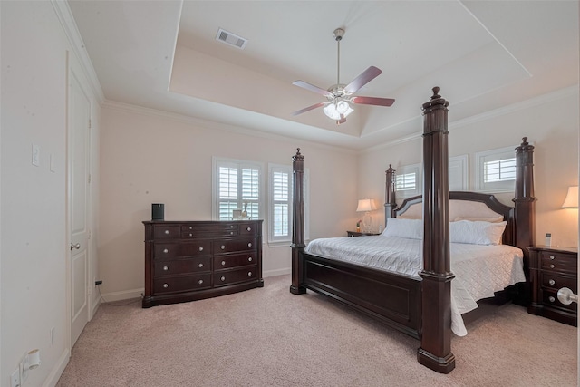 2303 Hadley St, Houston, TX 77003 - carpeted bedroom with multiple windows, a raised ceiling, baseboards, ceiling fan, and crown molding