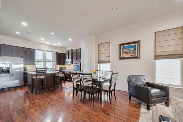 2303 Hadley St, Houston, TX 77003 - dining room featuring ornamental molding, dark wood-style floors, recessed lighting, and baseboards