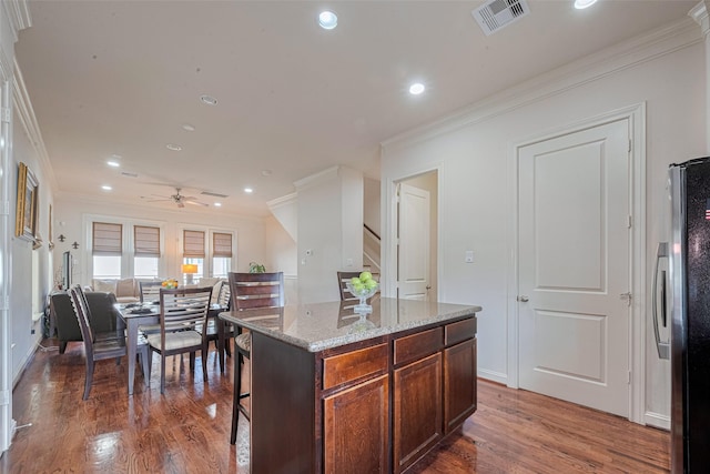2303 Hadley St, Houston, TX 77003 - kitchen featuring freestanding refrigerator, ornamental molding, wood finished floors, recessed lighting, and ceiling fan