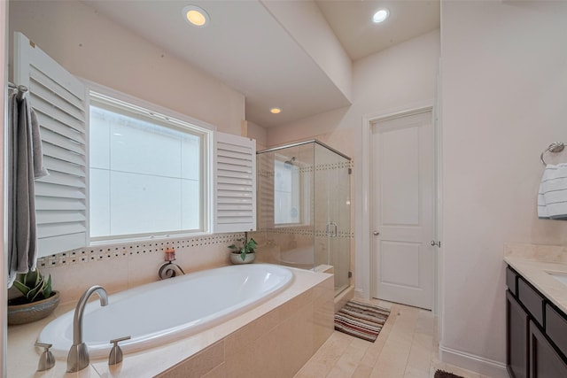 2303 Hadley St, Houston, TX 77003 - bathroom with a bath, vanity, a shower stall, and recessed lighting