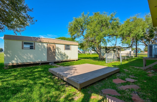 view of yard with a deck and fence