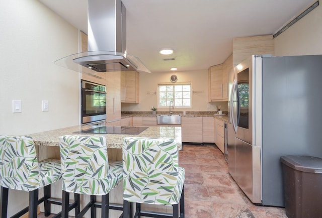 kitchen featuring a peninsula, island range hood, light brown cabinets, smart refrigerator, and black electric cooktop