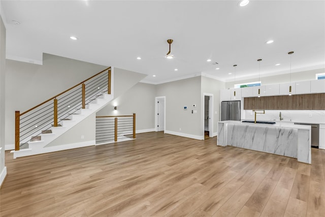 602 W 28th St Unit B, Houston, TX 77008 - unfurnished living room with a sink, recessed lighting, a ceiling fan, baseboards, and light wood-style floors