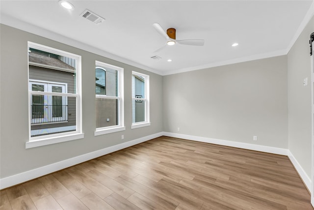 602 W 28th St Unit B, Houston, TX 77008 - empty room featuring crown molding, visible vents, light wood-style flooring, and a healthy amount of sunlight