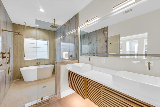 602 W 28th St Unit B, Houston, TX 77008 - full bath featuring a soaking tub, visible vents, a walk in shower, and a sink