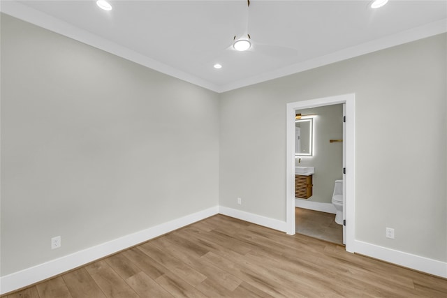 602 W 28th St Unit B, Houston, TX 77008 - unfurnished bedroom with ensuite bath, light wood-style floors, baseboards, and recessed lighting