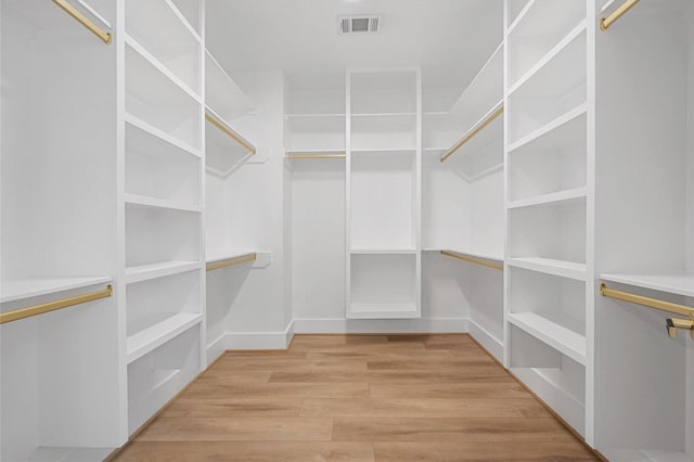 602 W 28th St Unit B, Houston, TX 77008 - walk in closet with light wood-type flooring and visible vents