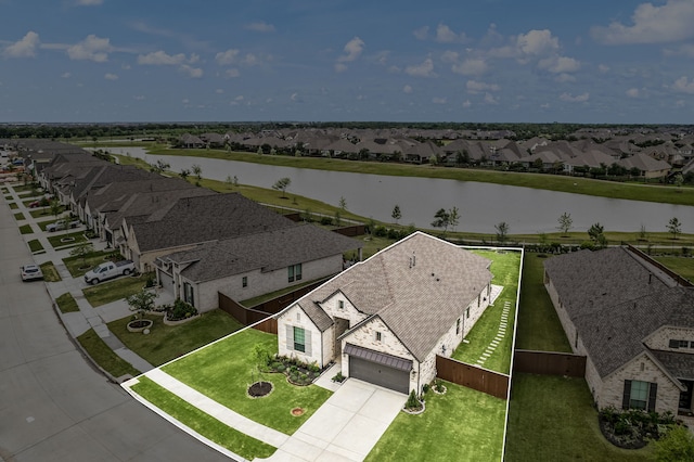 aerial perspective of suburban area featuring a nearby body of water