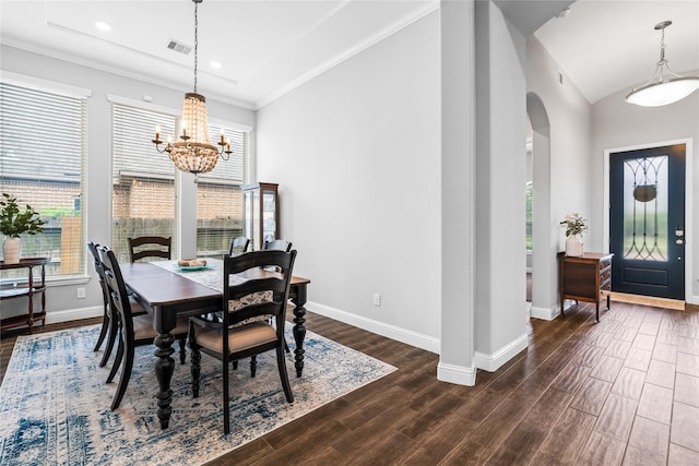 dining area featuring a wealth of natural light, arched walkways, visible vents, and dark wood finished floors