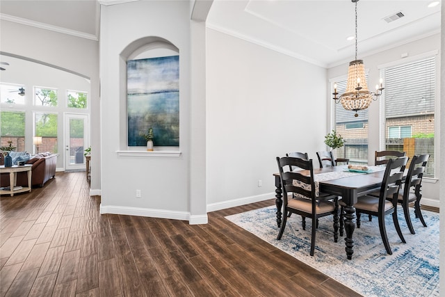 dining room featuring baseboards, dark wood-type flooring, and visible vents