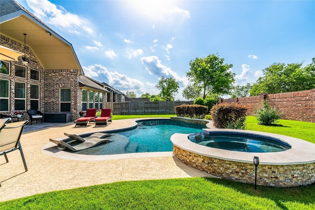view of pool with a fenced backyard, a patio area, a yard, and a pool with connected hot tub