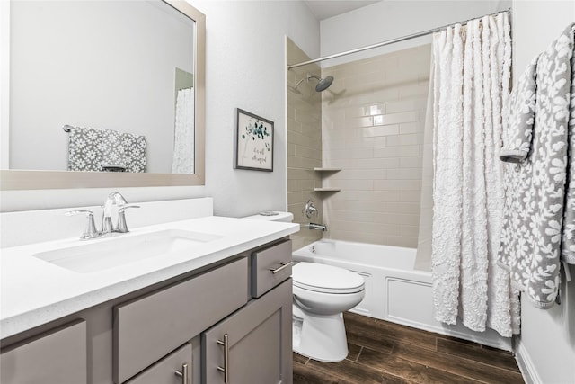 bathroom featuring vanity, toilet, shower / bath combo with shower curtain, and wood finished floors