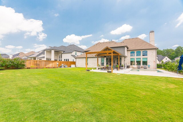 3923 Kelley Pond Dr, Spring, TX 77386 - back of property with a lawn, a chimney, a fenced in pool, a patio area, and a fenced backyard
