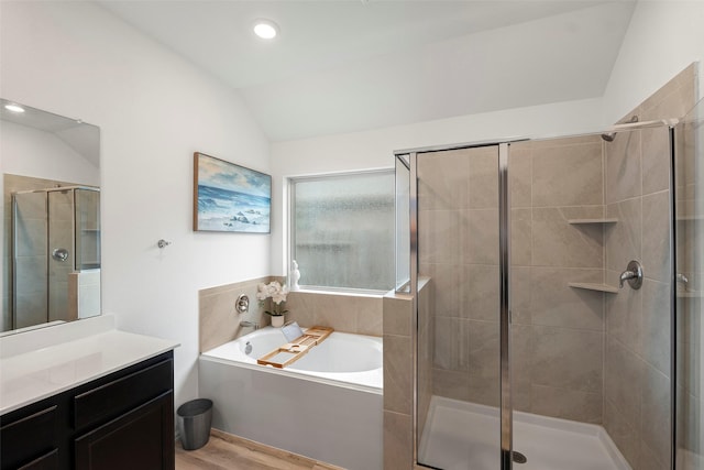 908 Pickering Oak Row, Magnolia, TX 77354 - full bath with wood finished floors, vanity, vaulted ceiling, a shower stall, and a garden tub