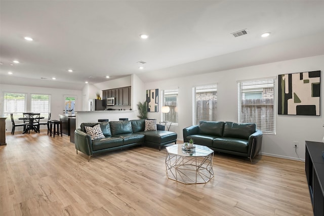 908 Pickering Oak Row, Magnolia, TX 77354 - living area with light wood-type flooring, visible vents, and recessed lighting