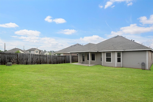 908 Pickering Oak Row, Magnolia, TX 77354 - back of property with a yard, roof with shingles, fence, and a patio