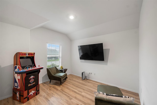 908 Pickering Oak Row, Magnolia, TX 77354 - living area with baseboards, vaulted ceiling, and wood finished floors